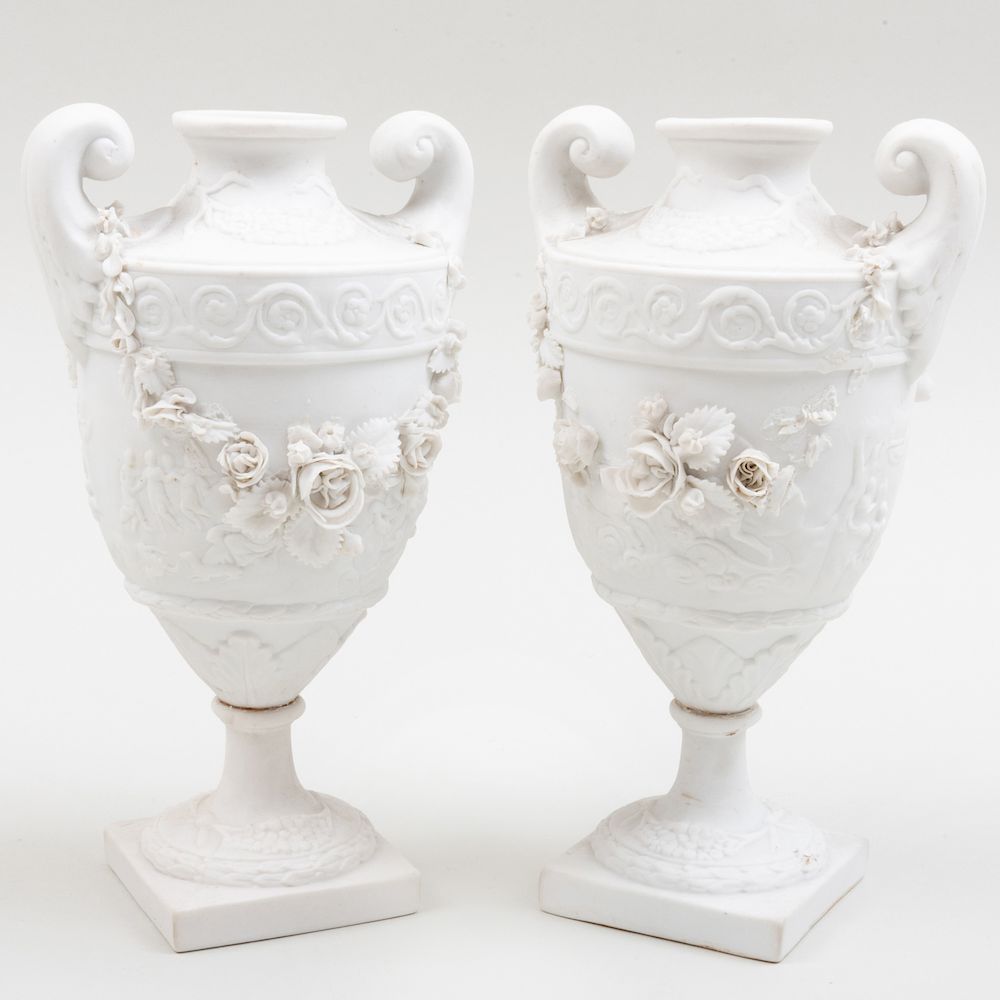 Appraisal: Pair of Continental Biscuit Porcelain Urns in high Condition Each