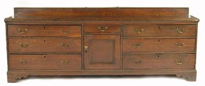 Appraisal: A large oak dresser the boarded top with a raised