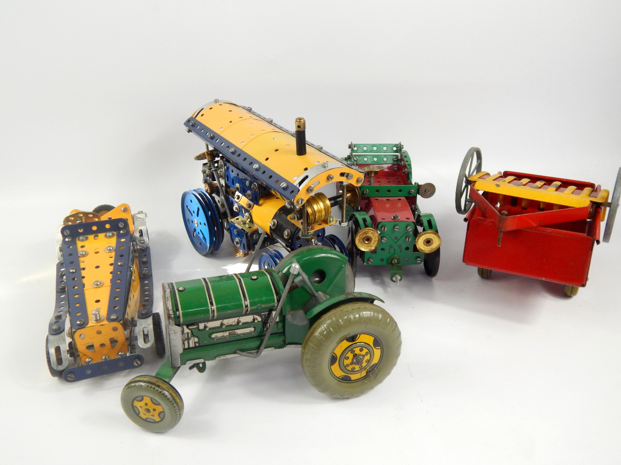 Appraisal: Four Meccano vehicles comprising a traction engine two cars and