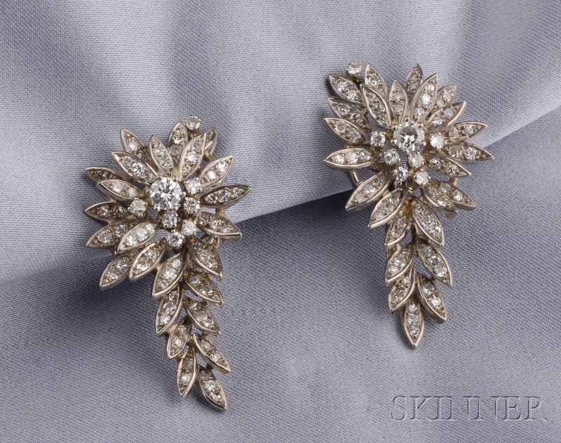 Appraisal: Platinum and Diamond Earclips the leaf forms prong and bead-set