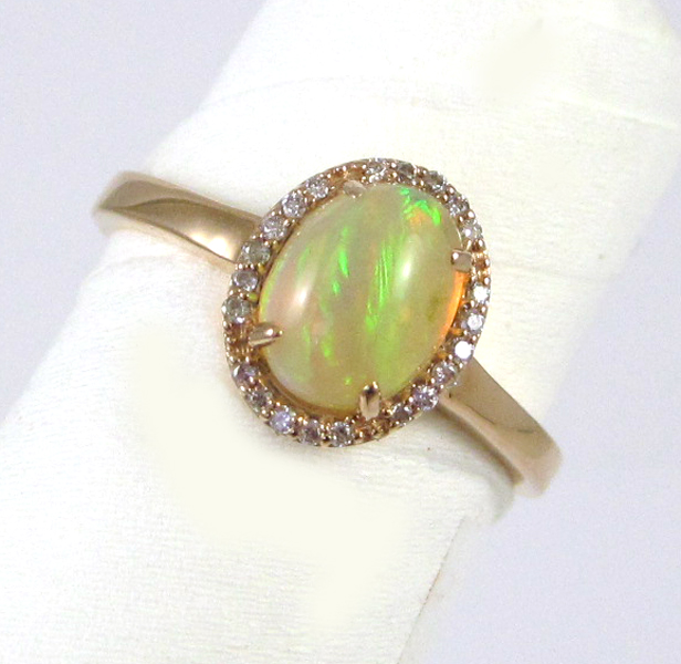 Appraisal: OPAL DIAMOND AND FOURTEEN KARAT GOLD RING The rose gold