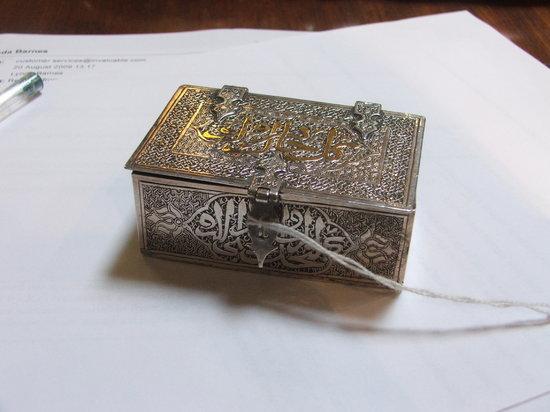 Appraisal: A MIDDLE EASTERN SILVER BOX with strap hinges engraved decoration