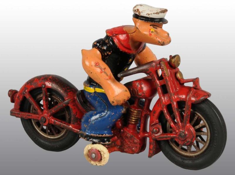 Appraisal: Cast Iron Popeye Motorcycle Toy Description Small balancing wheels are