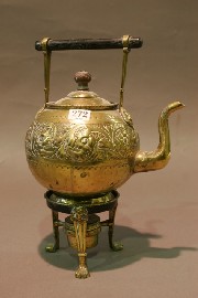 Appraisal: A brass teapot on stand