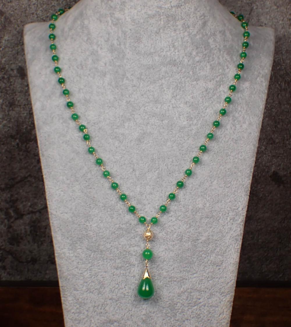 Appraisal: JADE AND FOURTEEN KARAT GOLD BEAD NECKLACE The - k