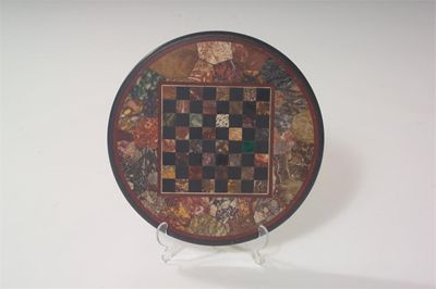 Appraisal: A circular specimen marble top inset with a chessboard cm