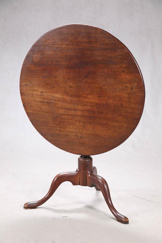 Appraisal: TILT TOP TABLE Walnut with a round top simply turned