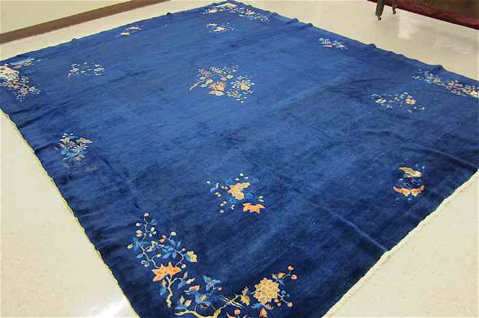 Appraisal: SEMI-ANTIQUE CHINESE CARPET hand knotted in traditional Peking design of