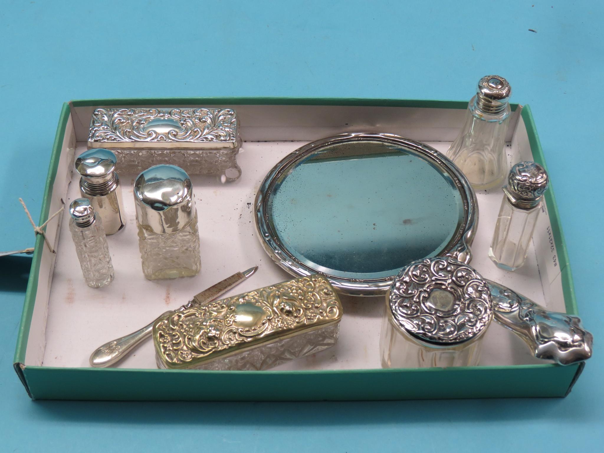 Appraisal: An embossed silver hand mirror Birmingham and other silver-mounted dressing