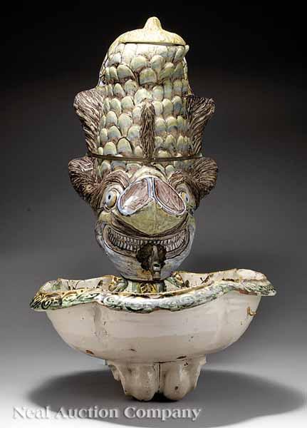 Appraisal: An Antique Majolica Lavabo in the form of a mythical