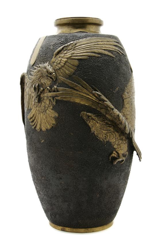 Appraisal: Japanese Bronze Vase the central panel depicting two fighting eagles