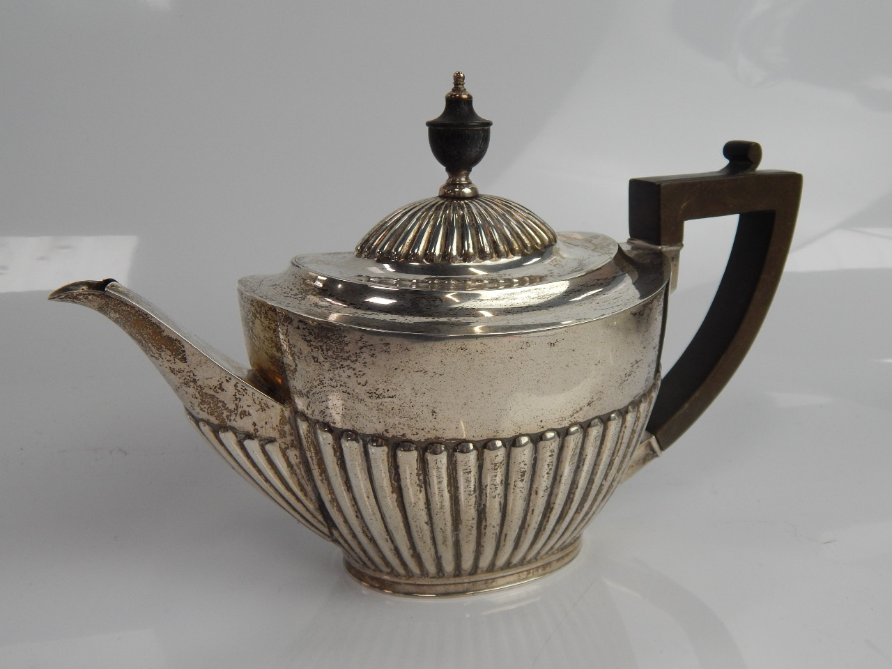 Appraisal: A George V silver teapot of oval design Sheffield makers