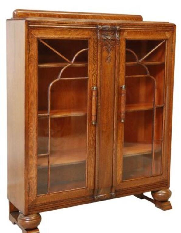 Appraisal: English Art Deco carved oak display cabinet bookcase c s