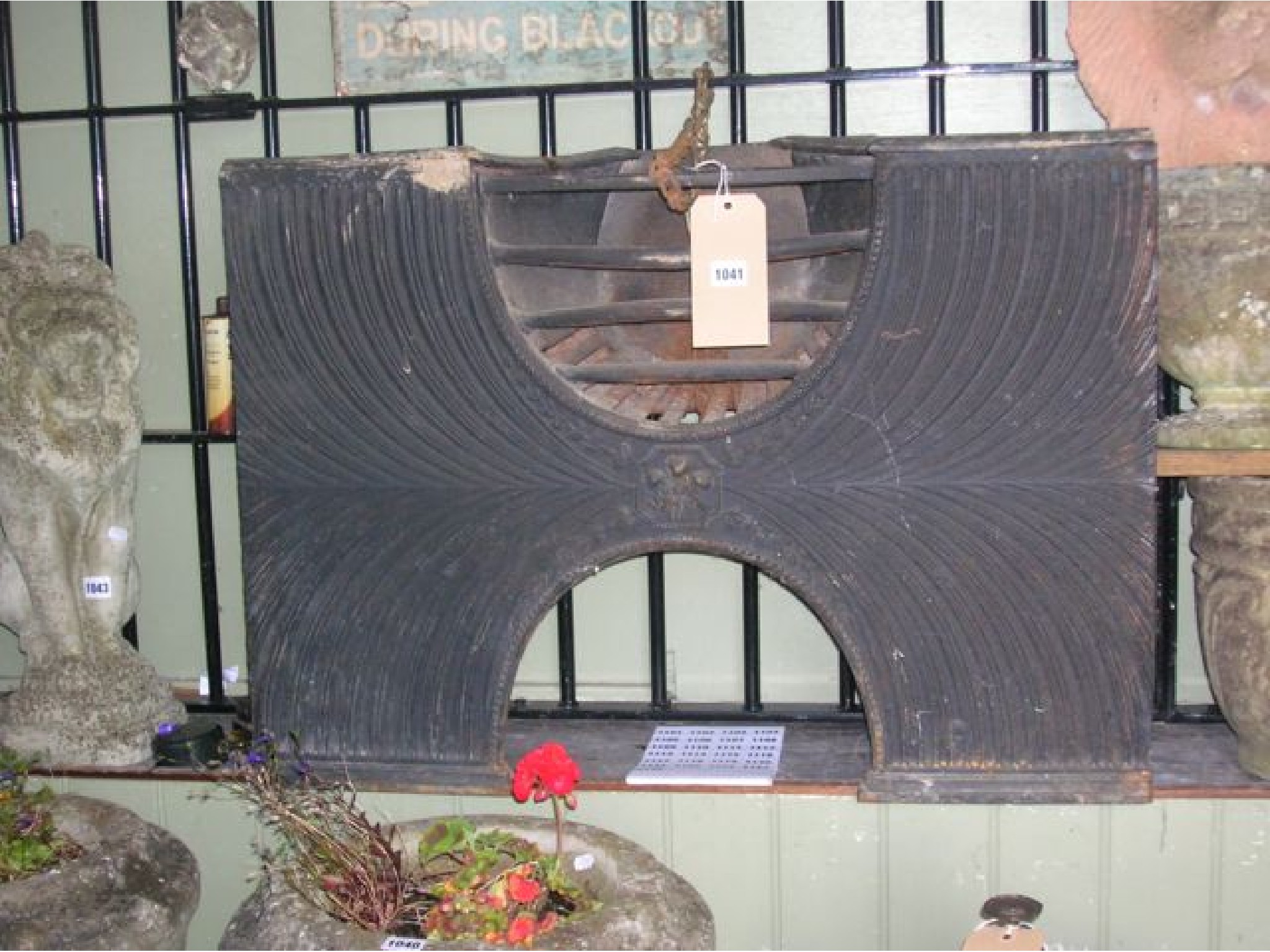 Appraisal: A Georgian cast iron hob grate with decorative relief fluted