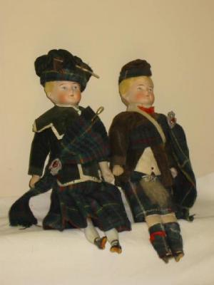 Appraisal: A pair of Heubach style boy and girl Scottish dolls