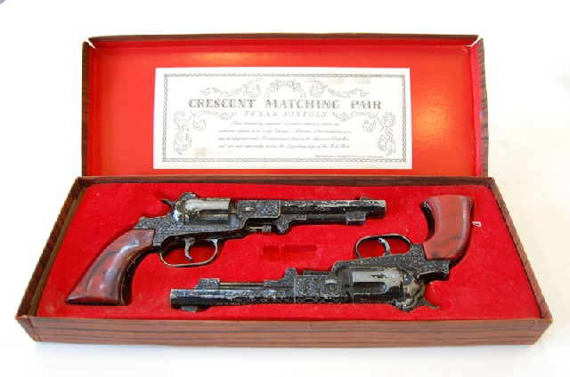 Appraisal: MATCHING PAIR OF TEXAN TOY PISTOLS