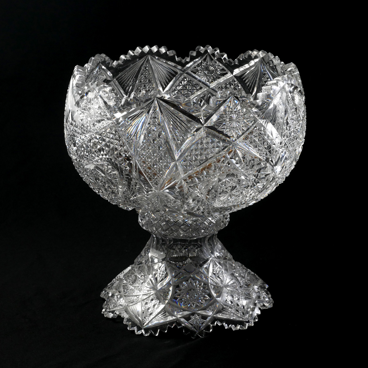 Appraisal: CUT GLASS PUNCH BOWL Elaborately deep cut brilliant glass Punch