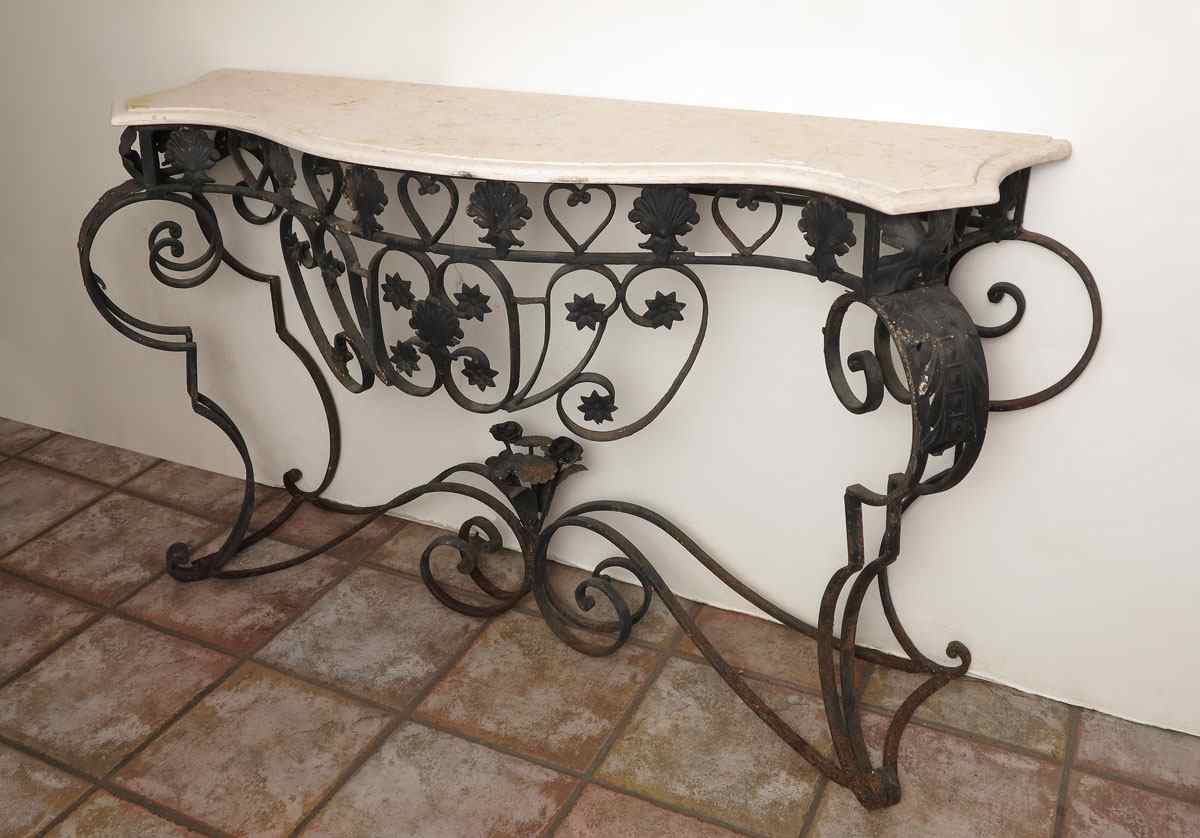 Appraisal: WROUGHT IRON MARBLE TOP CONSOLE TABLE Scrolling black iron base