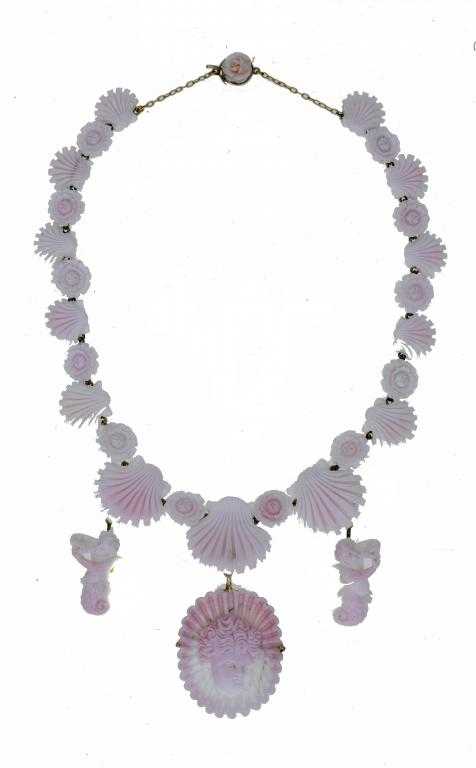 Appraisal: AN ANTIQUE WHITE CORAL NECKLACE formed of seashells and flowers