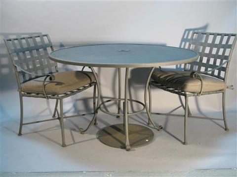 Appraisal: MODERN STEEL GARDEN TABLE AND FOUR CHAIRS The circular steel