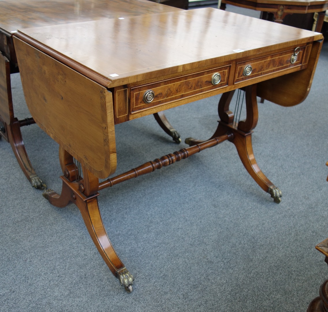 Appraisal: A yew wood sofa table of George III design with