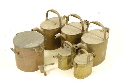 Appraisal: A set of three brass watering cans initialled 'L G'