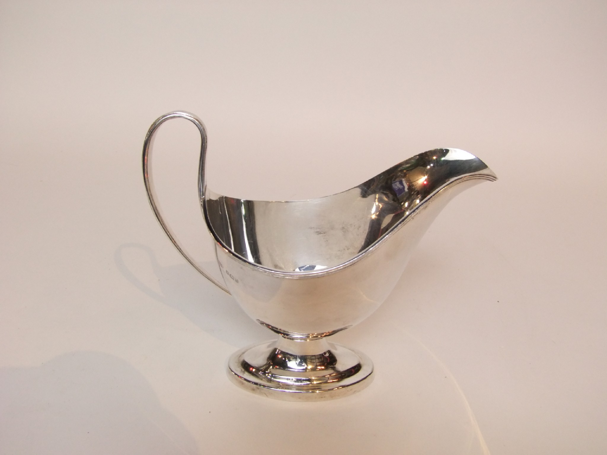 Appraisal: A silver sauce boat Roberts Belk Ltd Sheffield the plain