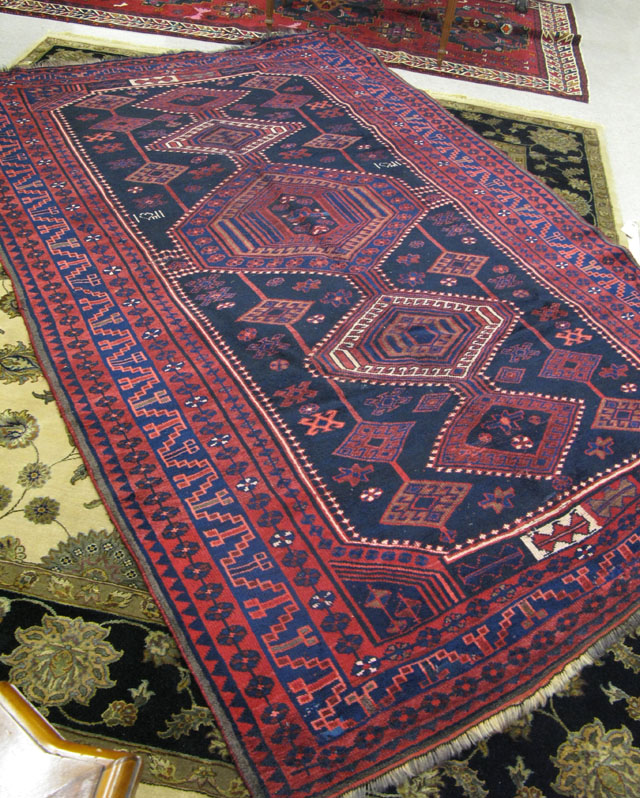 Appraisal: PERSIAN TRIBAL CARPET southwestern Iran overall geometric design on midnight