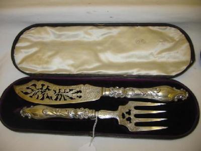 Appraisal: A PAIR OF VICTORIAN FISH SERVERS the blade pierced with