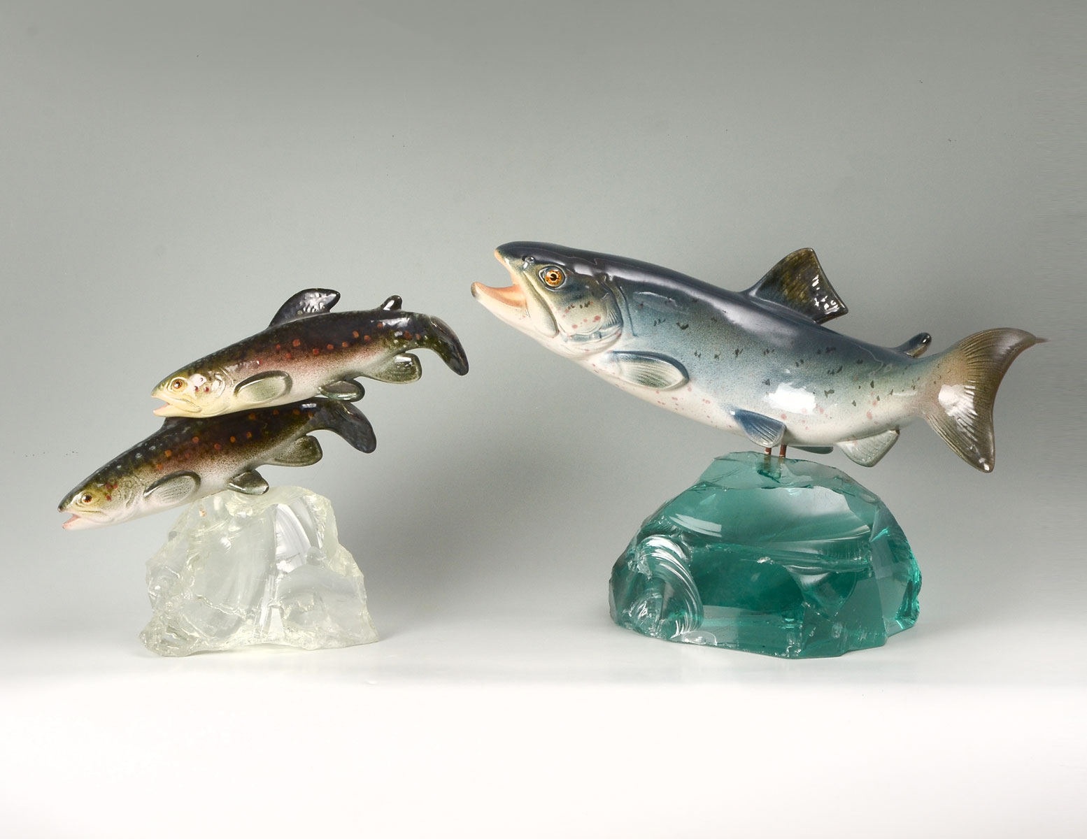 Appraisal: FRENCH PORCELAIN FISH ON GLASS PLINTHS Comprising a large porcelain