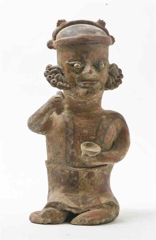 Appraisal: A Pre-Columbian Style Pottery Figure the male figure depicted seated