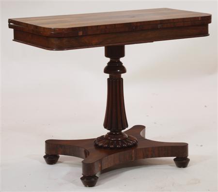 Appraisal: A Regency rosewood tea table the rounded rectangular top over