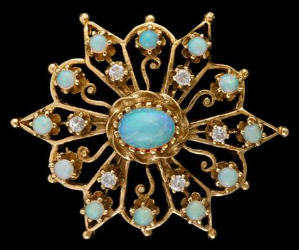 Appraisal: karat yellow gold opal and diamond 'sunburst' pendantSet with cabochon