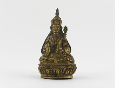 Appraisal: A Tibetan gilt bronze figure of Padmasambhava holding a vajra