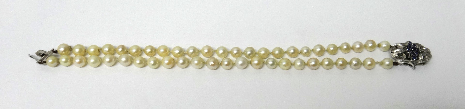 Appraisal: A two row bracelet of uniform cultured pearls on a