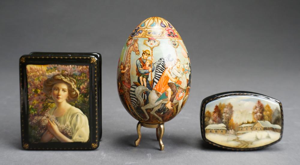 Appraisal: TWO RUSSIAN LACQUER BOXES WITH A FOLK ART PAINTED EGG