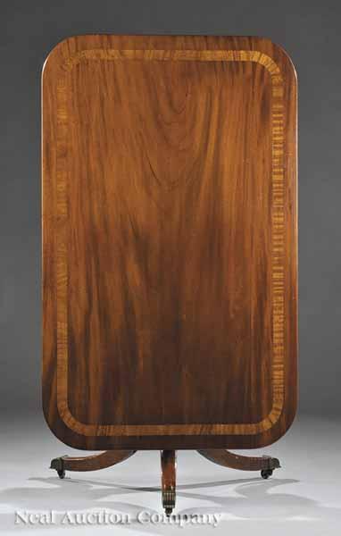 Appraisal: A George III-Style Inlaid Mahogany Dining Table th c rectangular