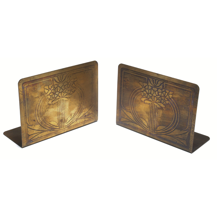 Appraisal: Arts and Crafts bookends bronzed metal with a tooled floral