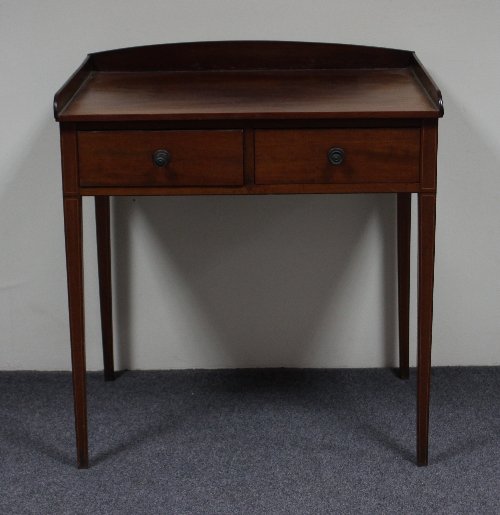 Appraisal: A George IV mahogany two-drawer washstand with three-quarter gallery cm