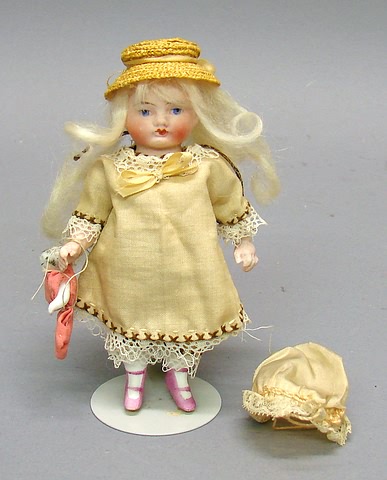 Appraisal: Unmarked doll with pc body and molded features Platinum mohair