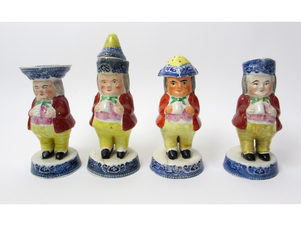 Appraisal: A set of four toby condiments with red tunics comprising