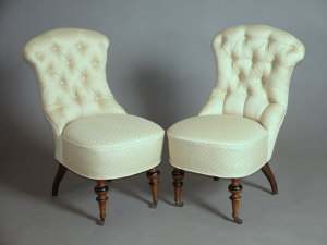 Appraisal: A pair of late Victorian walnut and button back upholstered