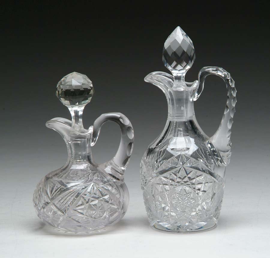 Appraisal: TWO CUT GLASS CRUETS Two cut glass cruets are both