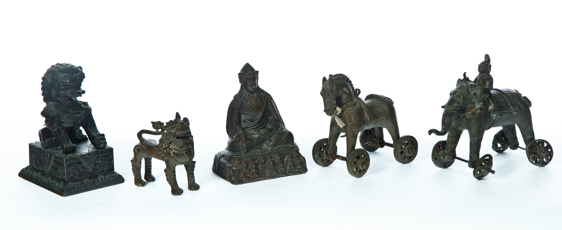 Appraisal: FIVE BRONZES Asian th century Wheeled horse and elephant with