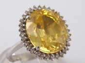 Appraisal: A white metal tests carat gold yellow topaz and diamond