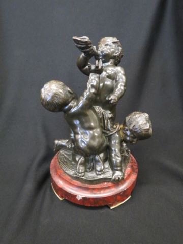 Appraisal: Bronze Statue of Three Boys one with horn red marble