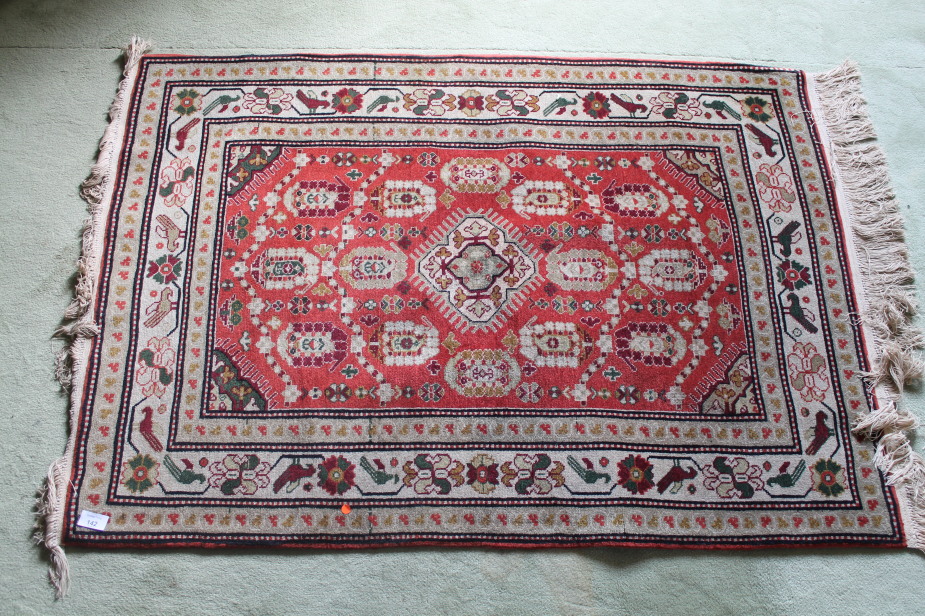 Appraisal: A red ground multi gul bordered rug cm x cm