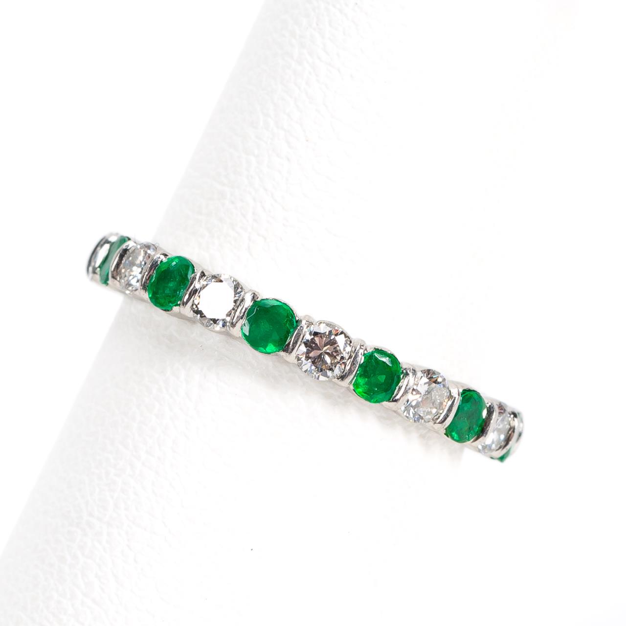 Appraisal: PLATINUM ETERNITY EMERALD DIAMOND BAND Modern platinum emerald and diamond