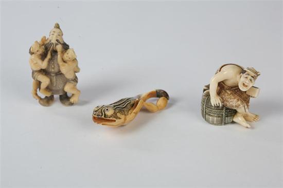 Appraisal: THREE NETSUKES Japanese th century ivory Man seated on a