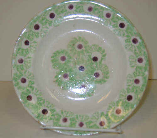 Appraisal: ENGLISH SPATTERWARE Green spatter plate having purple Christmas ball decoration